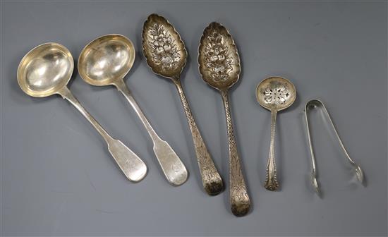 A pair of Georgian silver berry spoons, a pair of George IV silver sauce ladles, a silver sifter spoon and a pair of silver tongs